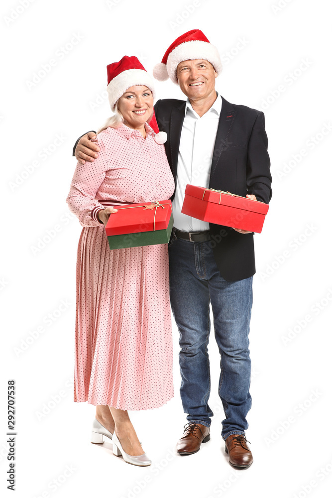 Obraz premium Happy mature couple with Christmas presents on white background