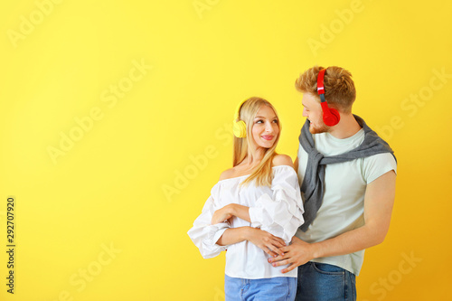 Young couple listening to m...