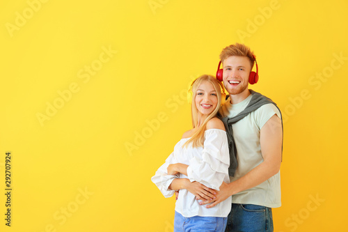 Young couple listening to m...