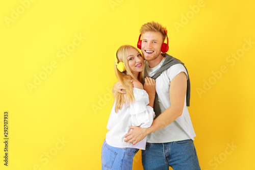 Young couple listening to m...