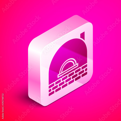 Isometric Brick stove icon isolated on pink background. Brick fireplace, masonry stove, stone oven icon.Silver square button. Vector Illustration