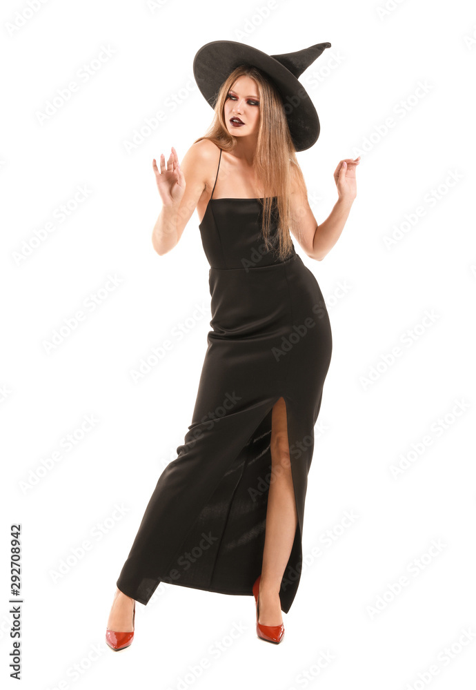 Beautiful woman dressed as witch for Halloween on white background Beautiful woman dressed as witch for Halloween on white background