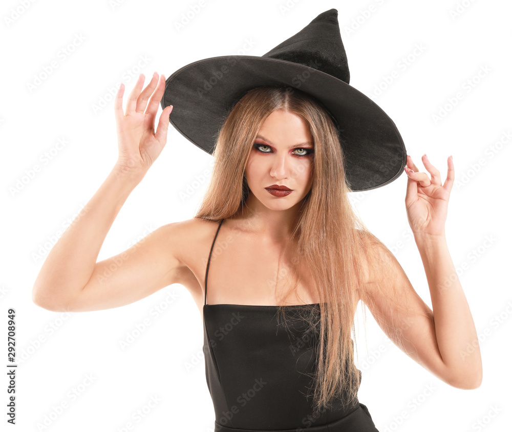 Beautiful woman dressed as witch for Halloween on white background Beautiful woman dressed as witch for Halloween on white background