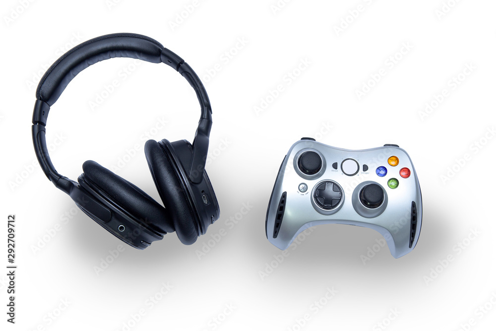 Game joystick, gamepad, and wireless headphones isolated on a white background. Game joystick, gamepad, and wireless headphones isolated on a white background.
