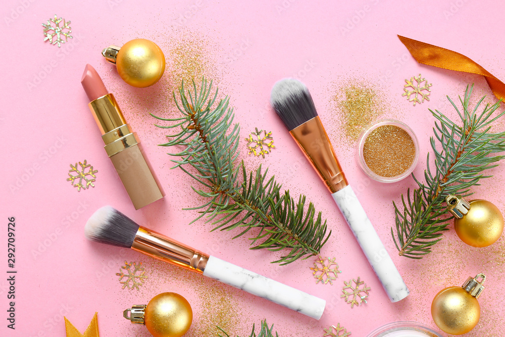 Set of cosmetics with makeup brushes and Christmas decor on color  background Stock Photo | Adobe Stock