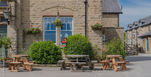 Tables and chirs in fron of a traditional pub in UK.