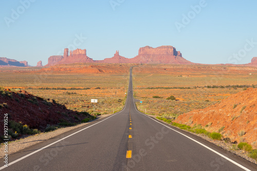 Monument Valley is a region of the Colorado Plateau characterized by a cluster of vast sandstone buttes, the largest reaching above the valley floor. It is located on the Arizona-Utah border. Tourism
