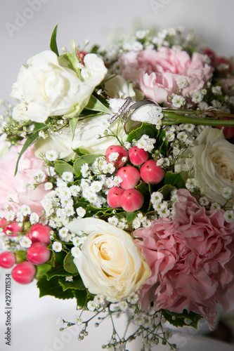 wedding fresh bunch of pink peonies and roses with marriage rings+