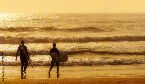 Surfers on beach, Durban, KwaZulu Natal, South Africa