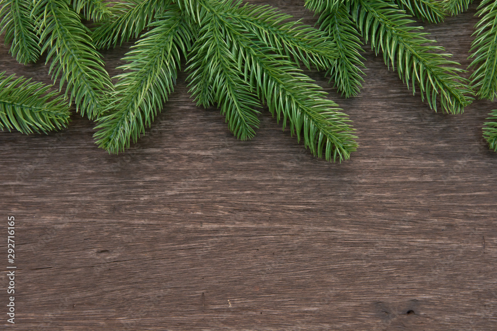 Christmas decorations with branches of fir tree on wood on wooden background. copy space Christmas decorations with branches of fir tree on wood on wooden background. copy space