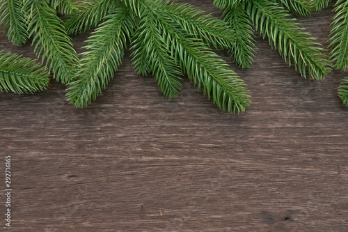 Christmas decorations with branches of fir tree on wood on wooden background. copy space