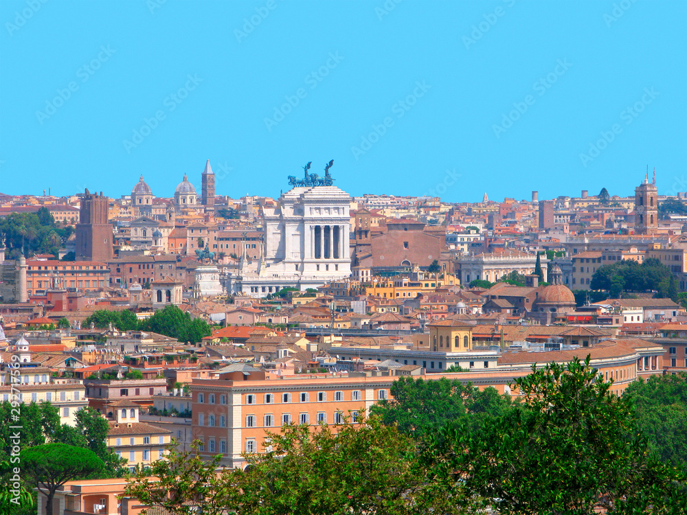 Italy, Rome. Panorama of the city with a monument to Victor Emmanuel II. View of the Eternal City from the Yanikul hill. General architecture with residental buildings, churches, trees on summer day.