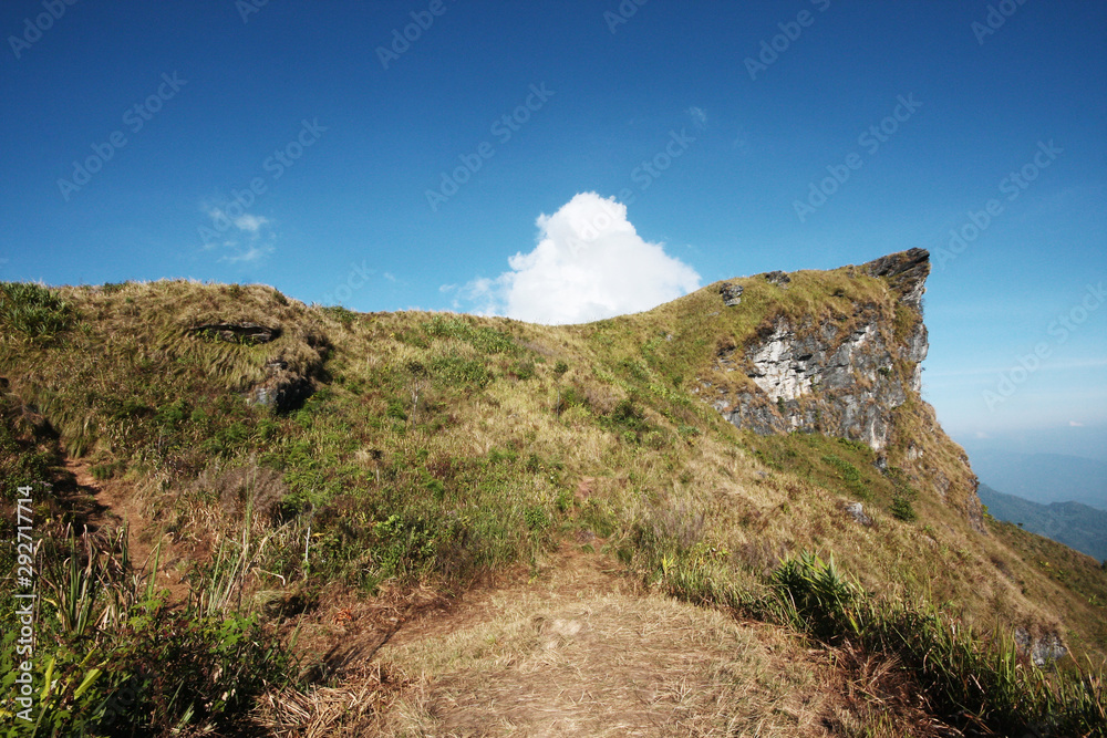 Beautiful landscape valley of mountain and blue sky in winter at Phu Chee Fah hill northern of Thailand