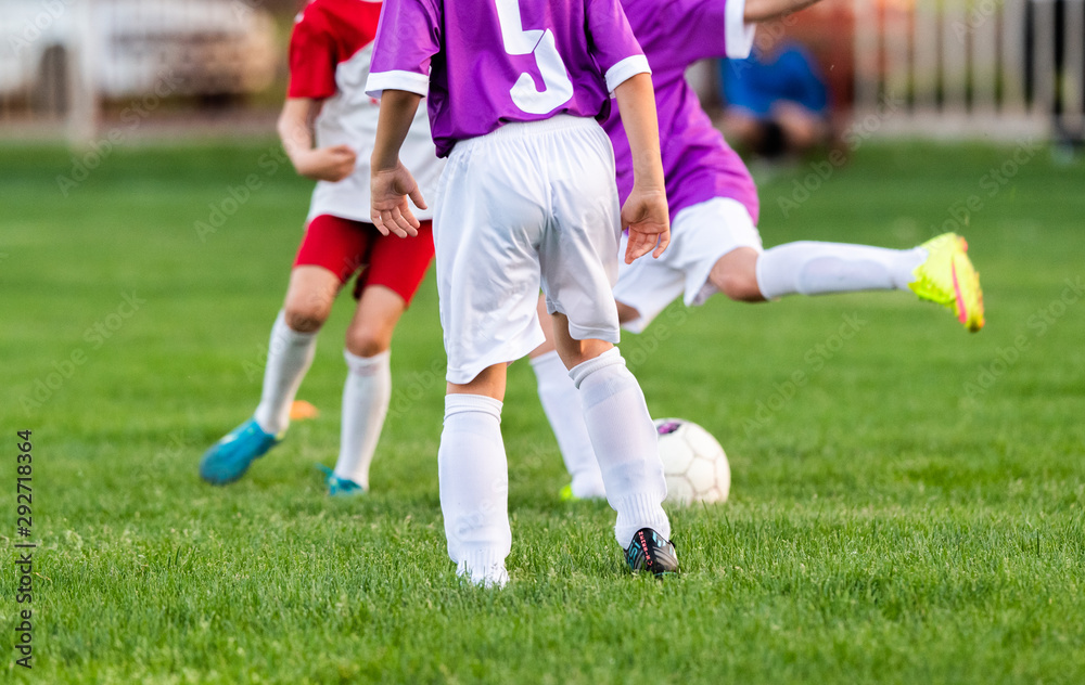 Obraz premium Young boys playing soccer.