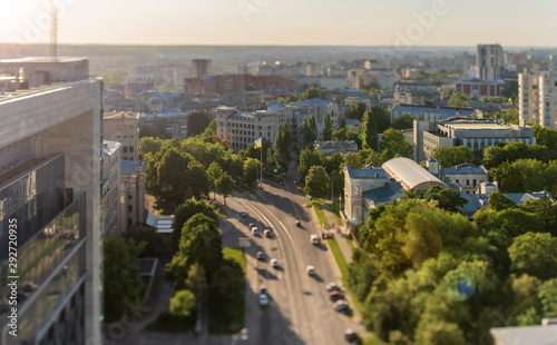 Aerial view of the central part of the city of Kharkov at sunset in tilt-shift (toys) style. Visible are the big flag of Ukraine in central part of Nezalezhnosti (Independence) Avenue