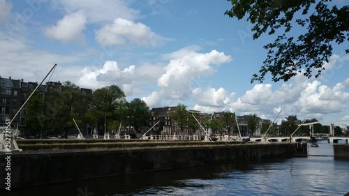 Amsterdam, Holland. August 2019. At the gates of the historic center on the Amstel river we find some barriers that regulate the flow of water. photo