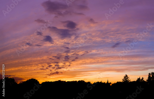 sunset in purple and gold clouds