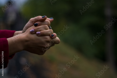 On blurred background, two young womens palms next. Gestures. Hands. © Vlada