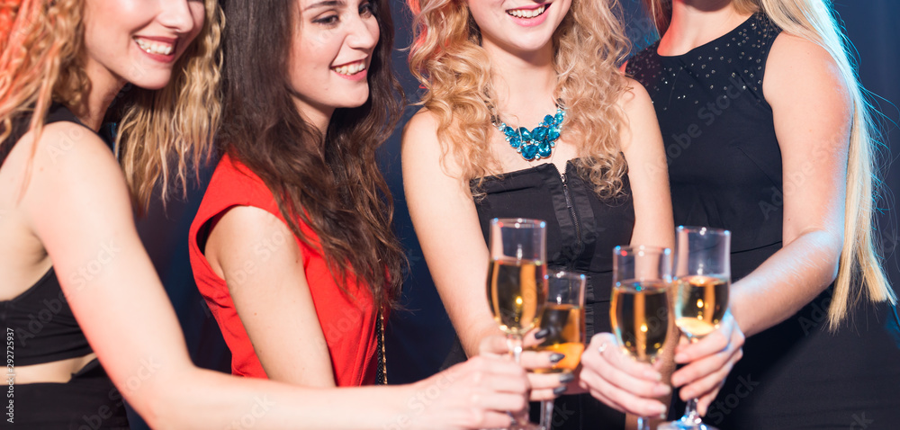 Birthday party, new year and holidays concept - Cheerful female friends celebrating with glasses of champagne, close-up
