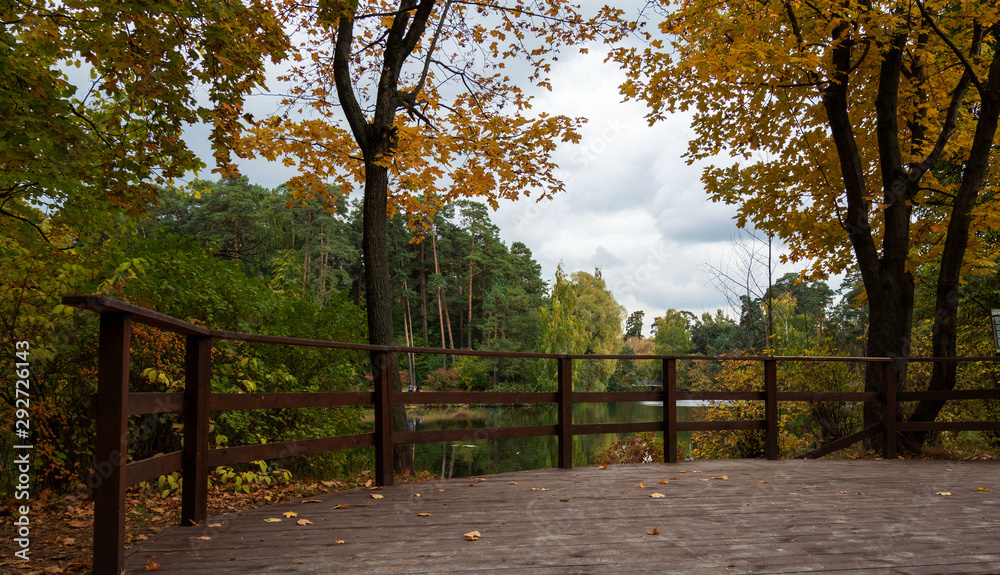 Autumn, river, trees, wooden flooring. Autumn, river, trees, wooden flooring.
