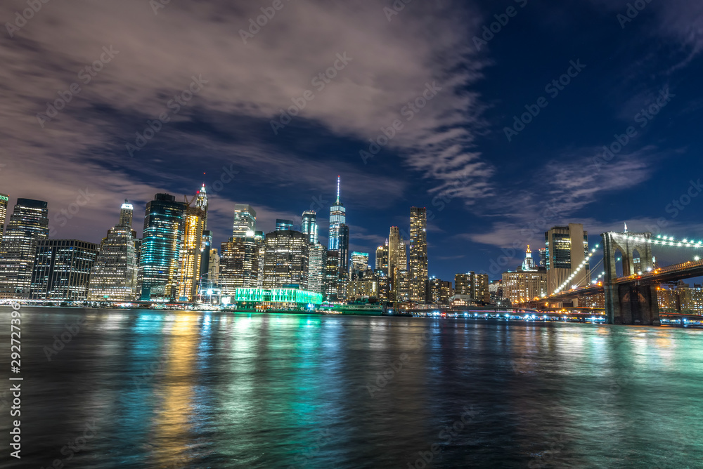 Skyline of Manhattan and Brooklyn bridge, night view Skyline of Manhattan and Brooklyn bridge, night view