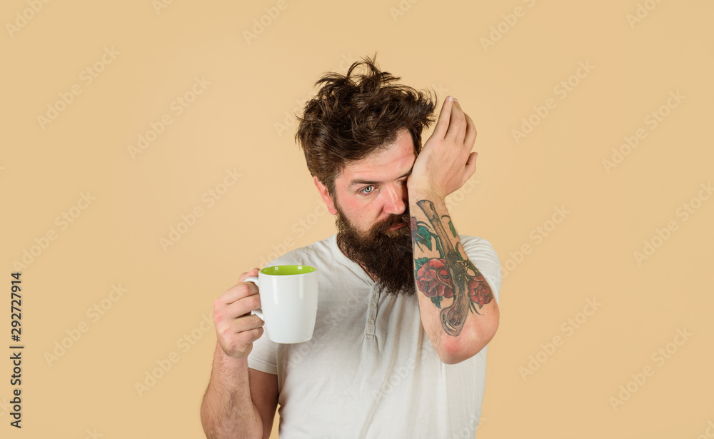 Big coffee cup with man drinking from hose