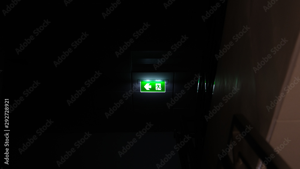 Emergency exit sign Shining light in the dark Emergency exit sign Shining light in the dark
