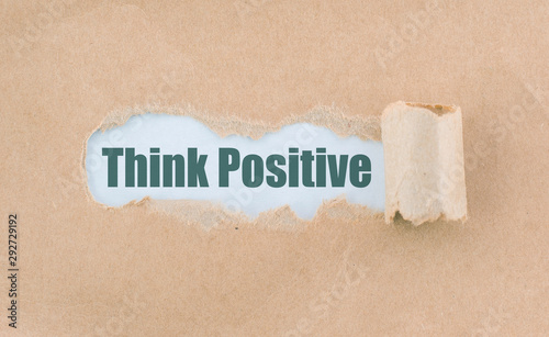 Letter Think Positive Written Behind Torn Paper