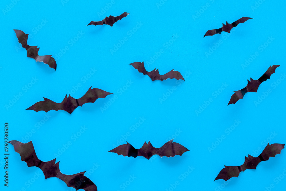 Halloween background with bats on blue table top view Halloween background with bats on blue table top view