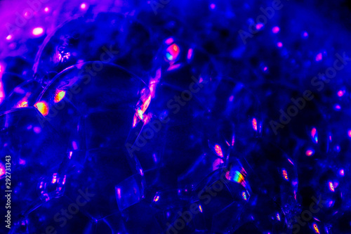 Beautiful abstract texture colorful black purple and blue bubbles background in water on darkness purple background pattern clear soapy shiny