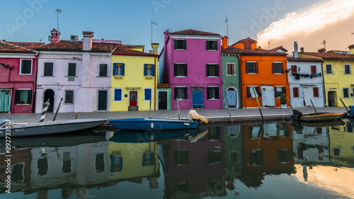 Reflection of colorful houses in the waters of the canal photo