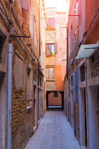 Narrow morning sunny street in Venice © Adamchuk
