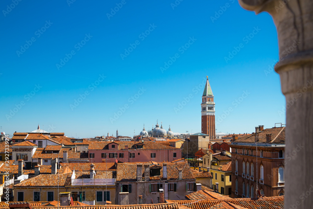 Panoramic view from the top of the spiral staircase at Palazzo Contarini del Bovolo, Venice (Venezia), Italy showing rooftops and the bell tower at San Marco.