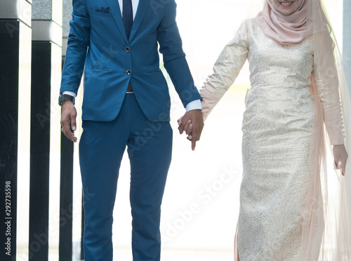 closeup shot of hands of bride and groom