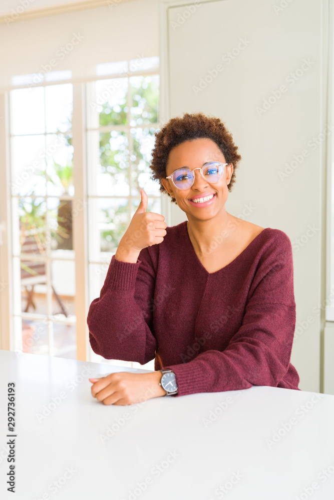 Beautiful young african woman with afro hair wearing glasses Beautiful young african woman with afro hair wearing glasses