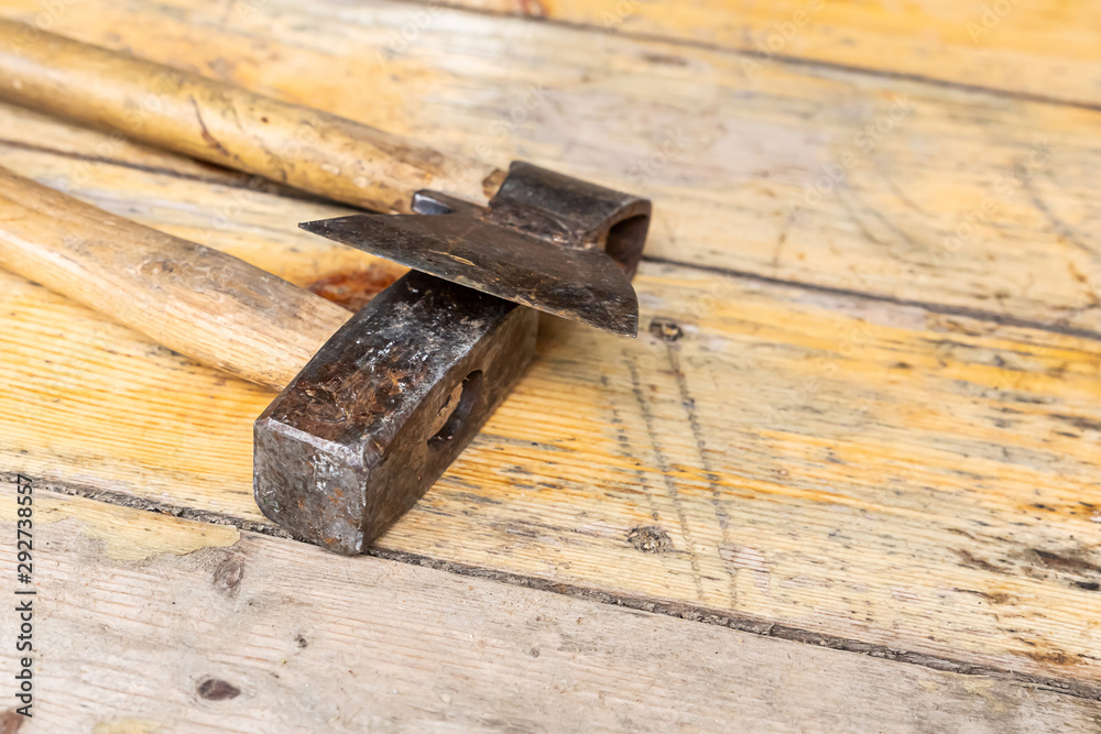 old working tools ax and hammer lie on wooden surface background construction old working tools ax and hammer lie on wooden surface background construction