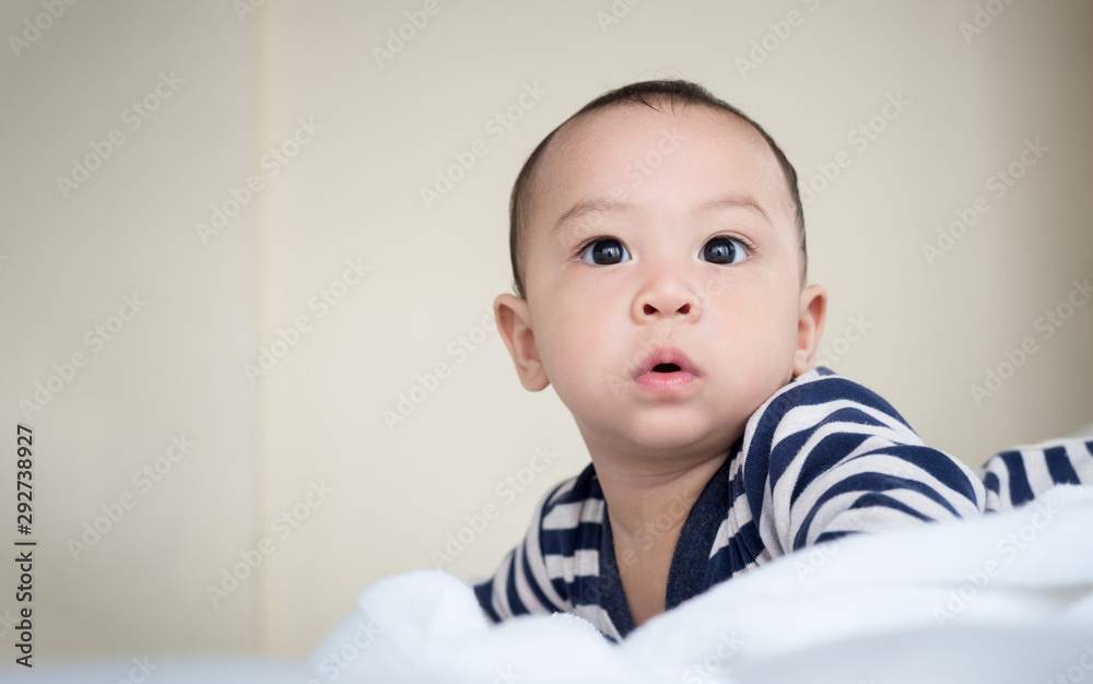 cute asian seven month baby in white dress smiling cute asian seven month baby in white dress smiling
