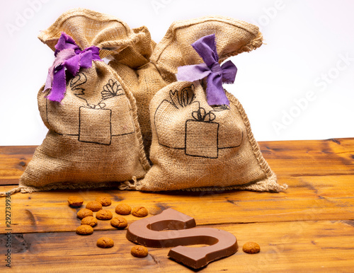 Celebration of Saint Nicholas, patron saint of children in Netherlands, Belgium, Luxembourg and North of France in first week of December, burlap sacks with presents and candy for kids photo