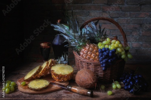 Still life with pineapples and wine photo