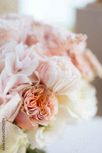 Wedding flowers, bridal bouquet closeup. Decoration made of roses, peonies and decorative plants, close-up, selective focus, nobody, objects