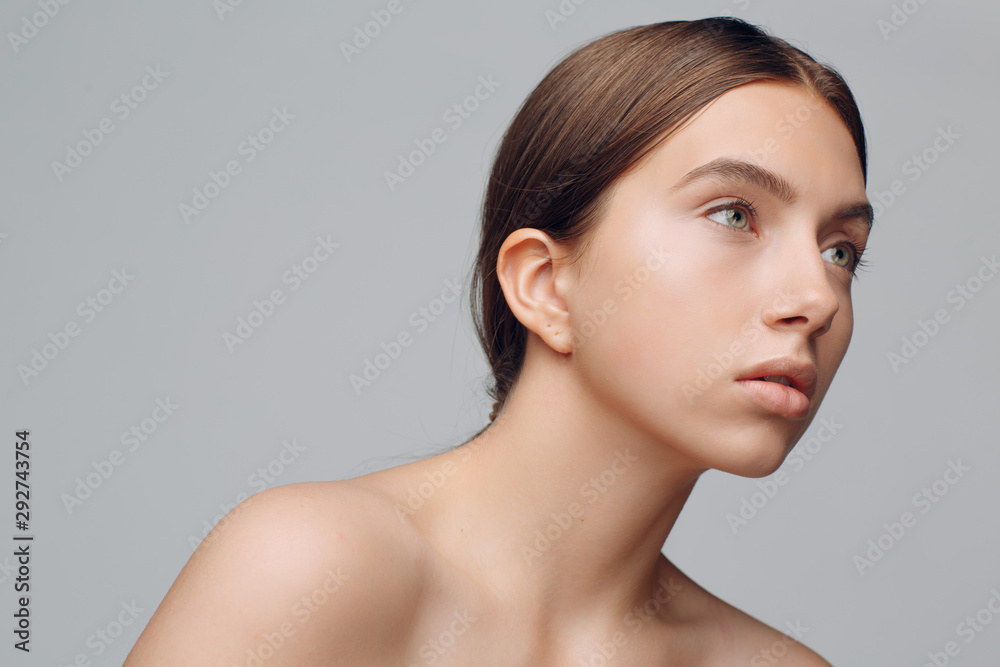 Portrait of young woman model in studio with natural make-up. Makeup concept. Portrait of young woman model in studio with natural make-up. Makeup concept.