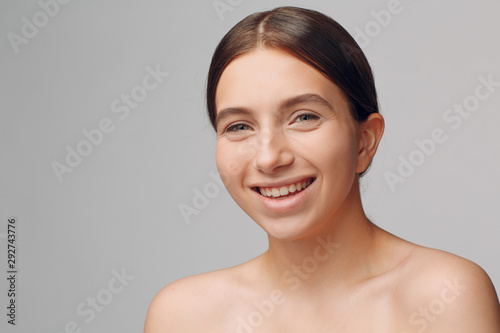 Portrait of young woman model in studio with natural make-up. Makeup concept.