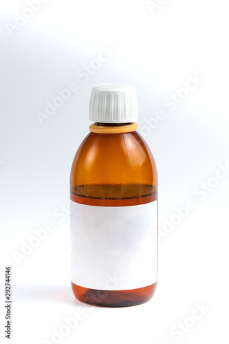 brown vessel with medicine and white label on white background