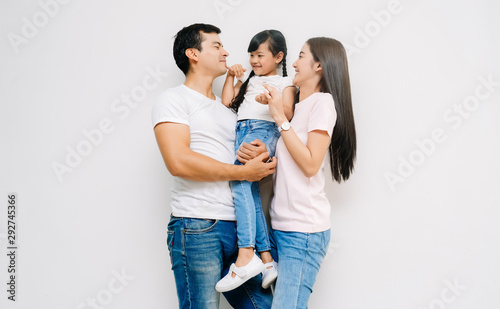 Portrait of happy Asian family with daughter, teasing dad and mommy. on white background. Weekend activity happy family lifestyle concept.