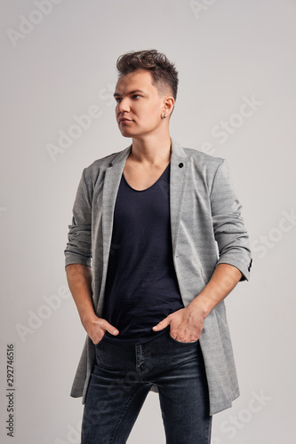 Portrait of a handsome man wearing wool jacket, black shirt and jeans © boomeart