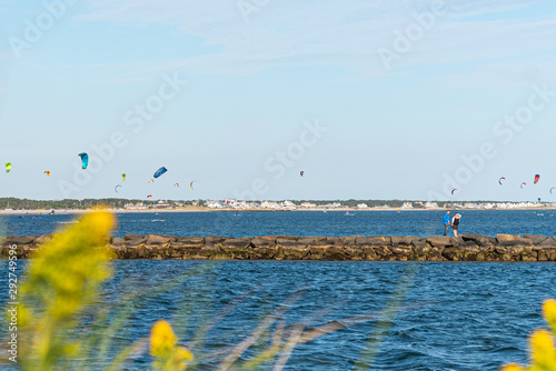 Photography Couple Walkkng on the Jetty at Bass River with Late September Surfers at West De