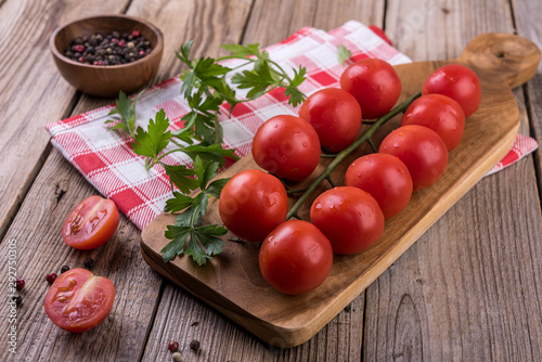 tomato sauce and fresh tomatoes on wooden table