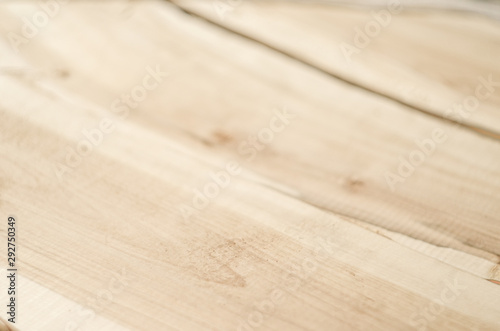 close up of rowan light brown wood profile surface selective focus blur background