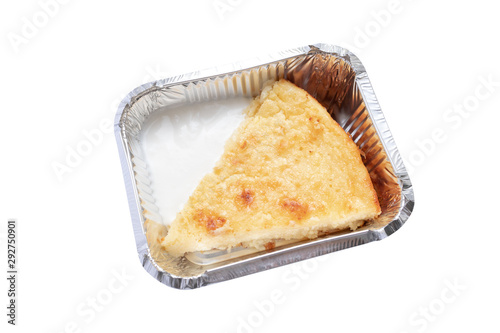 slice of cheesecake at foil container isolated on white. dessert lunch delivery concept photo