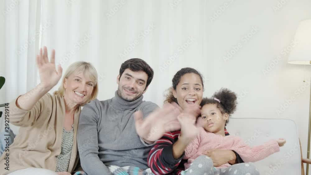happiness caucasian and latin family dad mother  grandmom and girls waving goodbye together